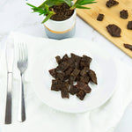 lifestyle shot of beef liver bites on a table setting