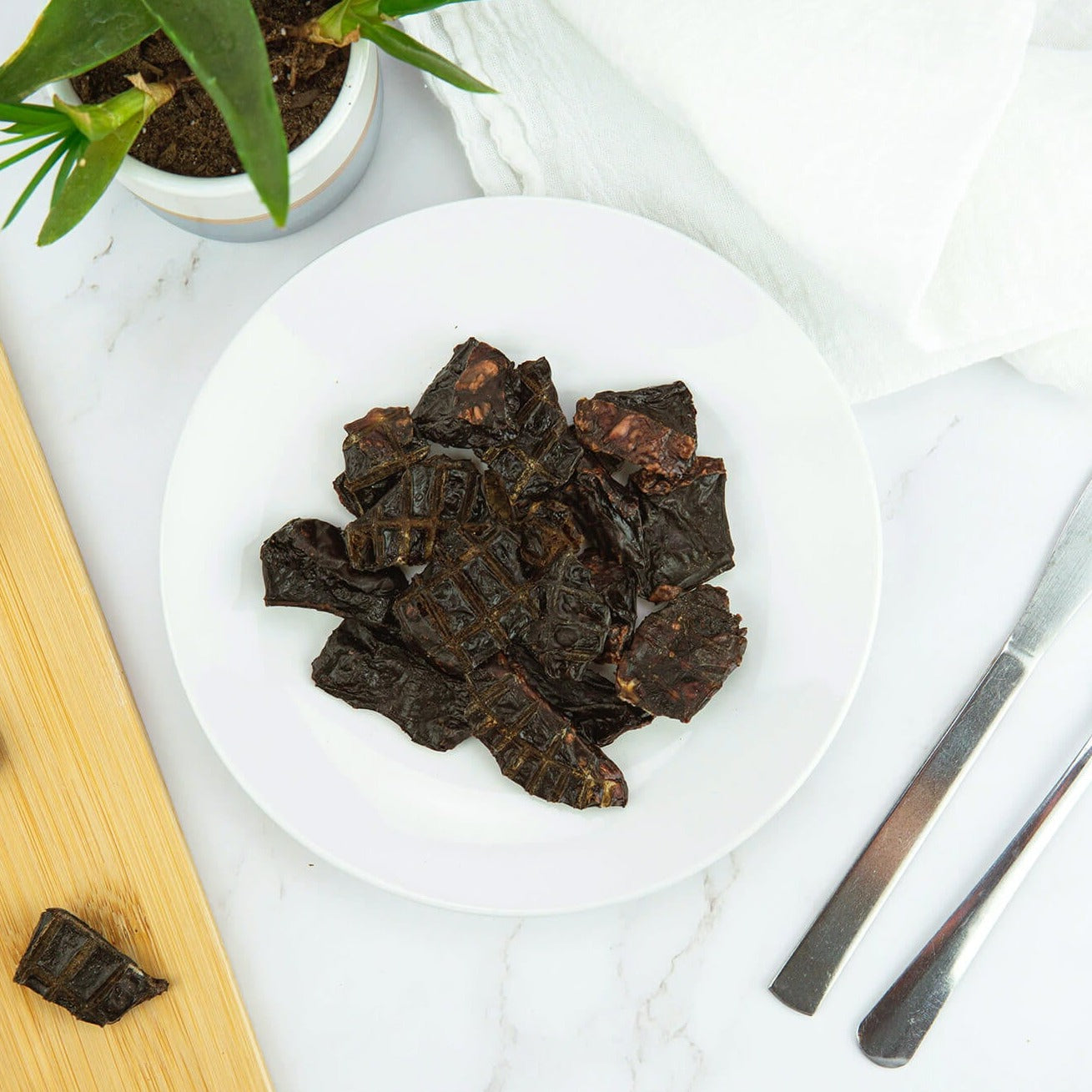 lifestyle shot of the beef spleen bites on a table setting